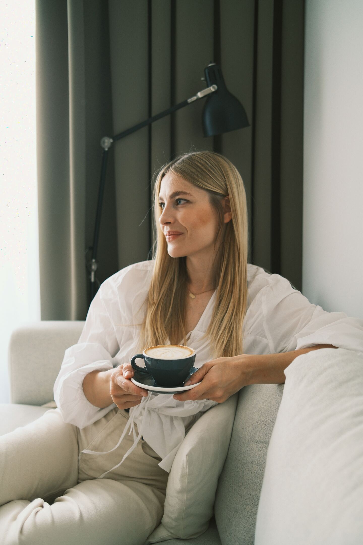 A quiet coffee on the sofa by the window