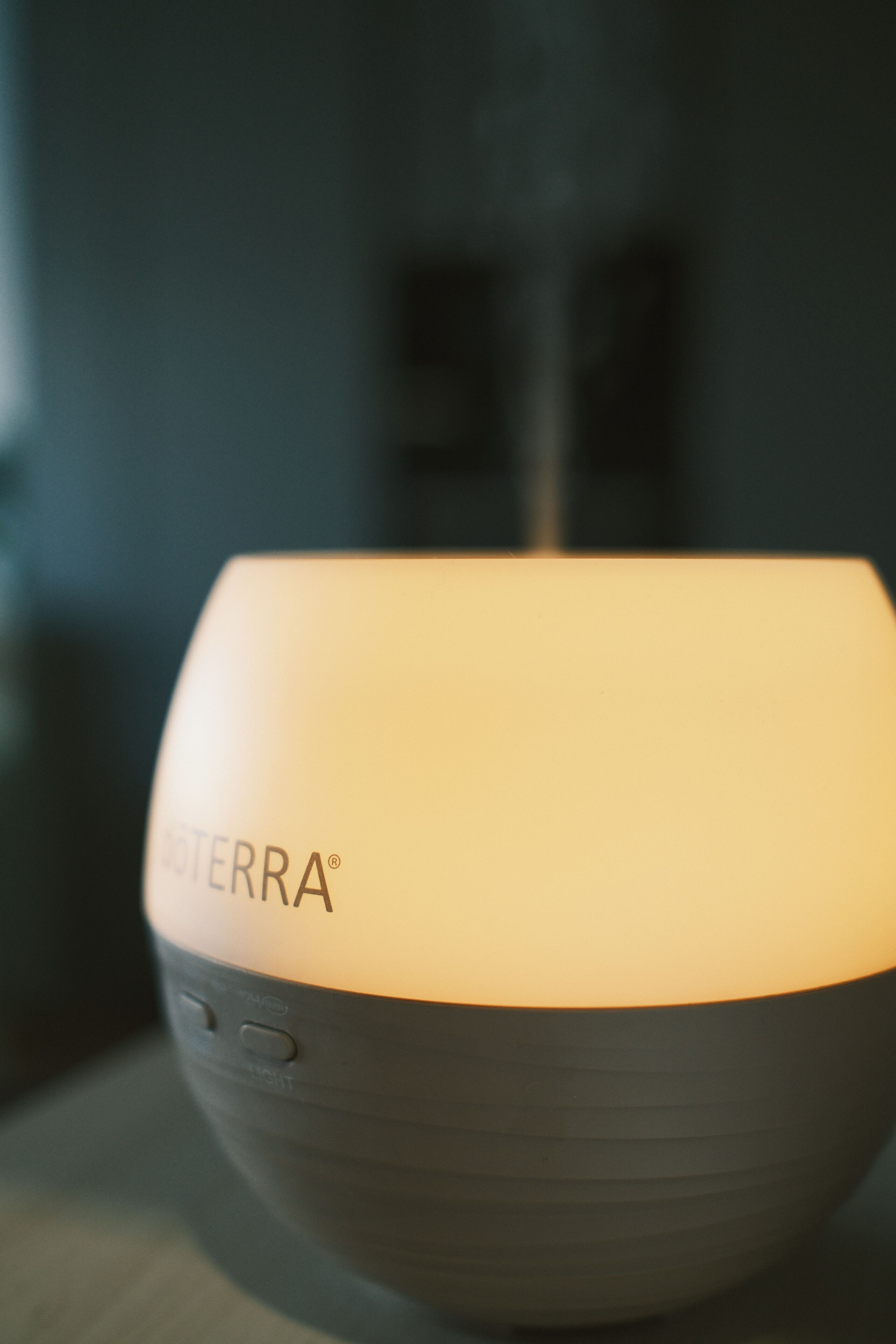 A diffuser glowing warmly in the evening