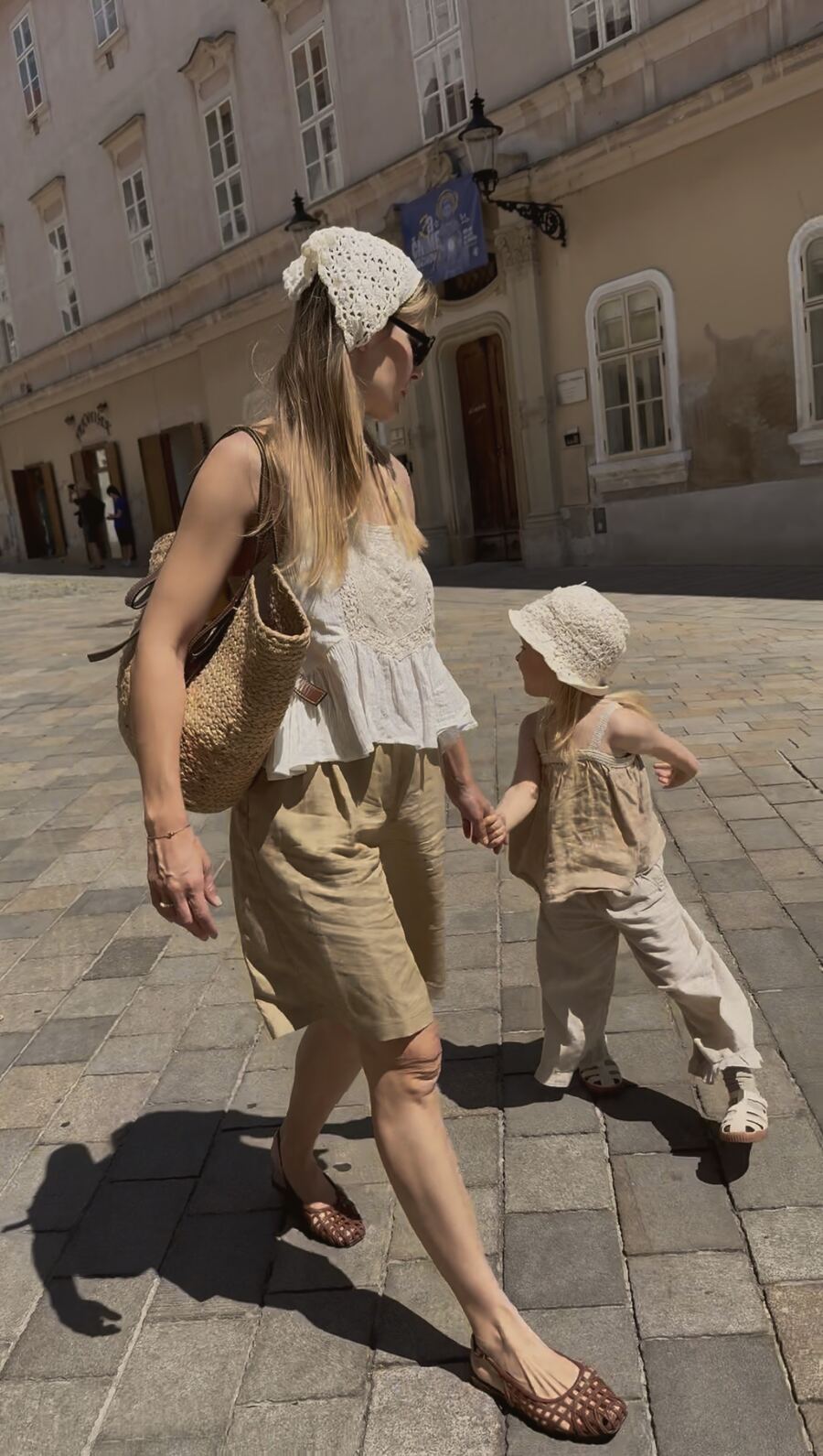 Walking hand in hand with my daughter through the old town